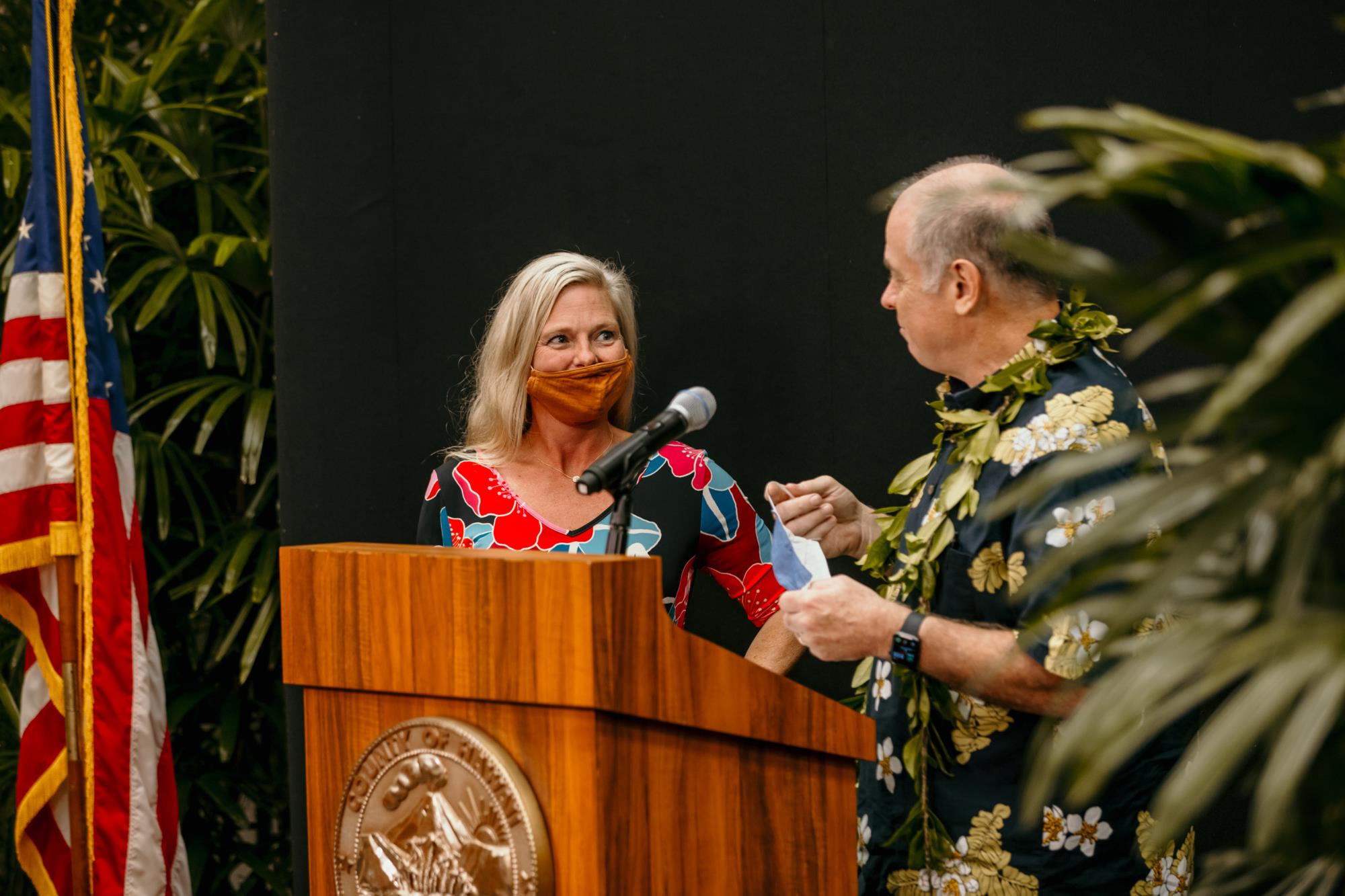 Mayor Mitch Roth congratulating Kate Logan for a successful summit